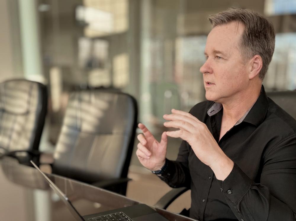 Kirk Bowman speaking with a client